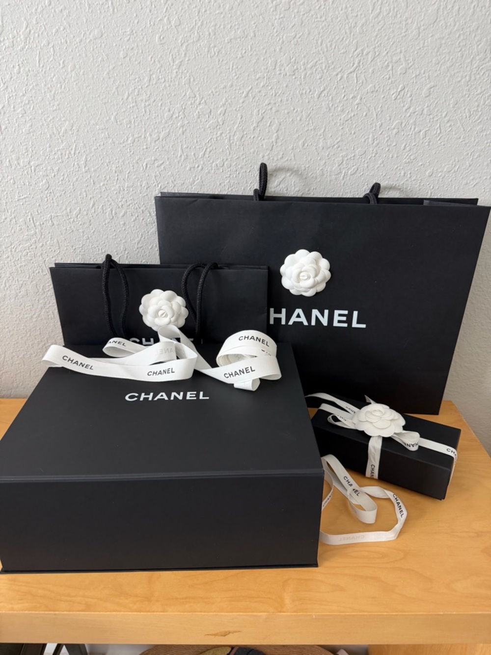 CHANEL Black Packaging Set with White Camellias and Ribbon